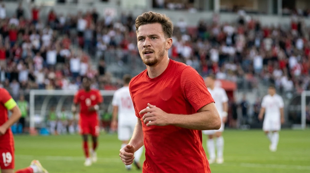 Illustration of Jacob Shaffelburg celebrating after scoring for Canada during a football match in Montreal.